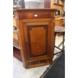 A mahogany hanging corner cupboard with small drawer to base.