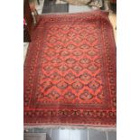Large early 20th century hand-knotted Afghan style rug in reds and blues. 295cm x 205cm.