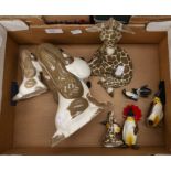 A collection of assorted figurines to include; Beswick penguins, Studio dogs and giraffes (Q)