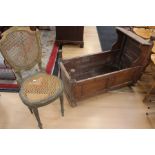 Victorian wooden crib A.F and gilt painted Empire style French chair with rattan seat