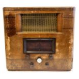 An early 20th Century wooden cased radio, approx 48cms high, 40cms wide, reference model number 556