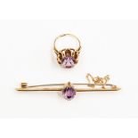 An amethyst and 9ct gold set bar brooch, set to the centre with an oval stone, along with a 9ct gold