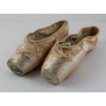 ***VENDOR WOULD LIKE SENT BACK****A pair of worn Darcey Bussell ballet shoes, signed with