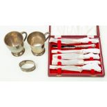 A set of mid 20th Century cased silver butter knives, two Birmingham marked christening cups A/F,