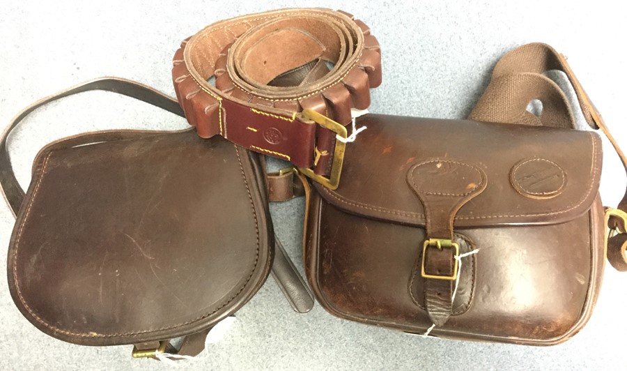 Shooting assesories: a William Evans marked medium size leather cartridge belt. Has loops for 25