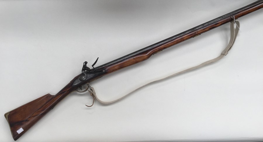 Flintlock Musket with 45.5 inch barrel. BP Proof mark. Action a/f. Overall length 61.5 inches. Brass