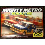 Scalextric: A boxed Scalextric Mighty Metro Set, together with a boxed Scalextric FJ30 Set; a