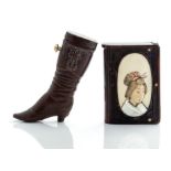 An early 20th Century vulcanite novelty vesta case, circa 1905, in the form or a lady's boot, height