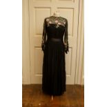 A black chiffon dress late 1960/1970 with a ribbon waist line - nylon zip embroidered bodice in pink