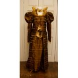 A reproduction brown & gold striped regency vicotian outfit, comprising of a long coat with Tudor