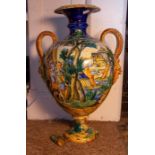 A large late 19th Century Cantagalli Majolica twin handled vase, the body decorate with an extensive