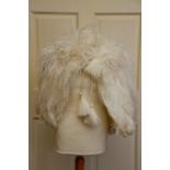 A 1920/30 Ostrich large feather cape in cream with robe & Ostrich feather tassels in original box (