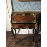 A 19th century French bureau de dame, inlaid with brass marquetry and tortoise shell, ebonised