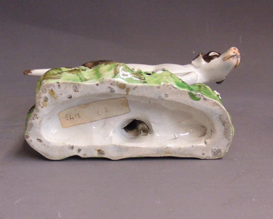 A Staffordshire pearlware model of a pointer, standing on a grassy base, circa 1820, 16cm wide,  9cm - Image 5 of 5