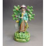 A Staffordshire pearlware  figure of a Lady Archer, circa 1820, 17.5 cm high Condition: tips of