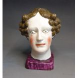 A Staffordshire pottery pearlware bust of Queen Charlotte, early 19th Century, 14cm high