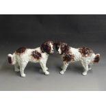 A pair of Staffordshire St Bernard dogs painted in russet and brown,  circa 1860, 35cm high, 24cm