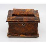 A Regency style tortoiseshell tea caddy, of sarcophagus from, interior with twin lidded