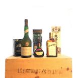 Seven bottles of mixed liqueurs and brandies, in a woven hamper. ( 7)