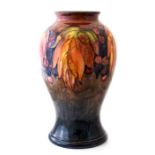 A Moorcroft flambe baluster vase, leaf and berry pattern, circa 1935, impressed marks, impressed