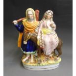 A  well coloured Staffordshire figure of ‘Flight into Egypt’  Joseph, Mary and baby Jesus,  circa