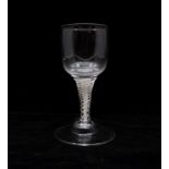A late 18th Century wine glass, circa 1770, possibly Dutch, double opaque spiral twist stem, domed