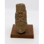 An Indian carved stone head of a Hindu deity, Mathura Uttar Pradesh, the face now degraded, 14.5cm