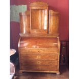 A 19th Century Biedermeier three part birds eye maple and ash veneered secretaire.  The upper