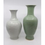A Chinese white monochrome baluster vase, moulded in low relief with leaf tips to the neck,