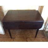 A George III mahogany pembroke table, circa 1820, one dropleaf on each side above a single drawer