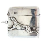 An Edwardian silver vesta case, the cover with a greyhound sprinting in relief,  maker Clark &
