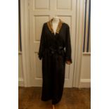 a black satin Robe with a pale peach lining with a coffee colour lace collar, covered buttons and