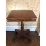 A Late Regency rectangular burr walnut wine table, circa 1815, on a carved turned collumn to a