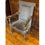 A mid 17th Century oak wainscot chair, circa 1650, leaf carved triangular shape panel back within