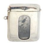 An Edwardian silver vesta case, the front with an inset photograph of a huntsman, maker A& J