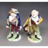 Two Naples 20th Century ‘Commedia de’arte’ figures, painted blue crown and N, 14cm high (2)