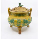 A Chinese porcelain tripod censer and cover, Qing dynasty, 18th/19th Century, with overall yellow