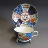 A Worcester tea cup and saucer painted with a version of the Old Mosaic pattern, circa 1768-72,