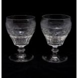 A pair of Regency clear cut glass goblets, ogee bowls with board cut bases, knopped stems, ground