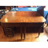 A Regency mahogany extendable dining table in a gillows manner, circa 1800, two semi curved