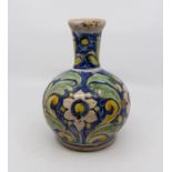 An Italian maiolica pottery bottle vase, Caltagirone style, 19th Century, painted with scrolling