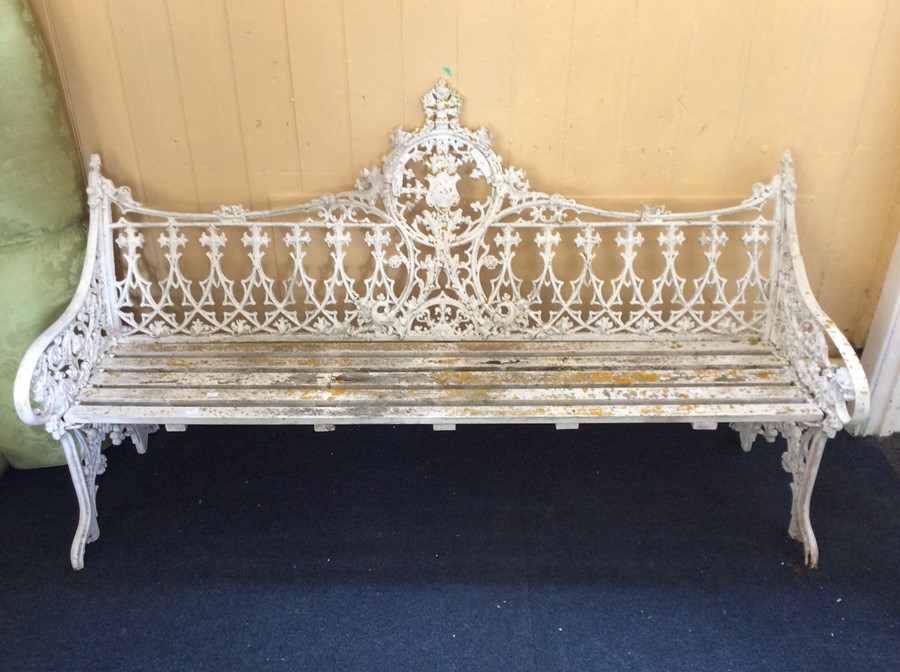 A Victorian cast iron garden bench, in the manner of Coalbrookdale, painted white, having cast - Image 2 of 2