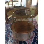 A George III mahogany and brass campaign three tier washstand, circa 1820, brass gallery on each