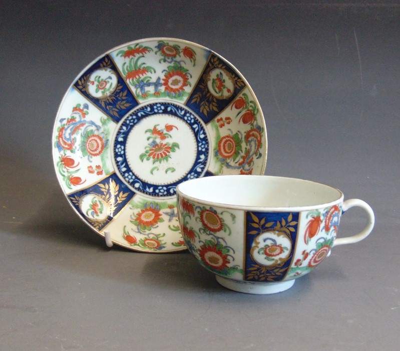 A Worcester tea cup and saucer Dr Wall period painted with the Queens pattern, circa 1765 72, cup