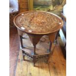 A late 19th Century olive wood Middle Eastern Islamic circular occasional table on a octagonal