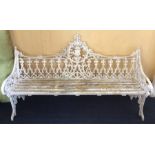 A Victorian cast iron garden bench, in the manner of Coalbrookdale, painted white, having cast