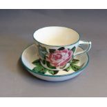A Wemyss tea cup and saucer, painted with cabbage roses, circa 1900, cup has Thos Goode mark, saucer