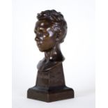 Paterne Berrichon (French, early 20th Century), a bronze bust of the French Poet Rimbaud, on an