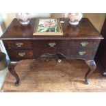 A George I walnut lowboy, circa 1720, quarter veneered top above five frieze drawers, square-section