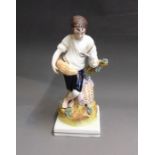 An early Staffordshire figure of ‘Summer’ depicting a boy holding a scythe and a sheaf of corn,